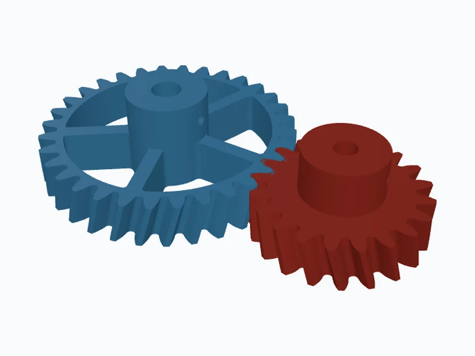 A pair of meshing helical gears, one with spokes and a hub